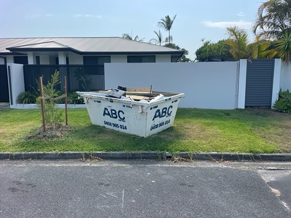 ABC Skip Bin full of waste outside home